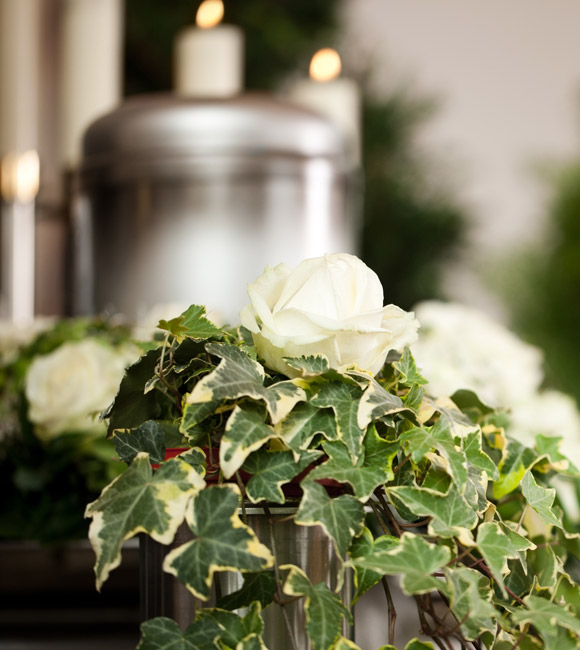 urn behind white flowers